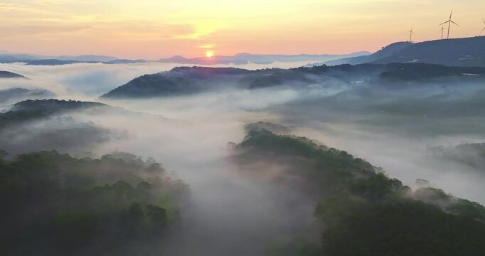 Aerial view of the Cau Dat suburbs near Da Lat city at morning with misty sky in Vietnam highlands