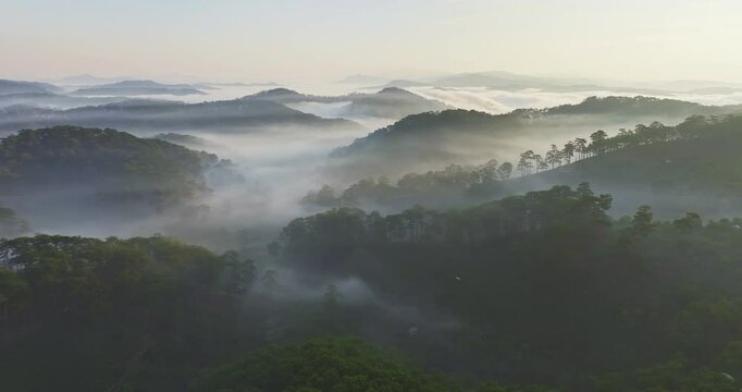Aerial view of the Cau Dat suburbs near Da Lat city at morning with misty sky in Vietnam highlands