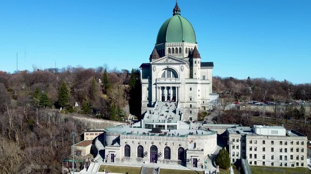 4K drone footage of Montreal, Canada. Aerial view of the downtown skyline, historic buildings, St. Lawrence River, and iconic landmarks during golden hour light.