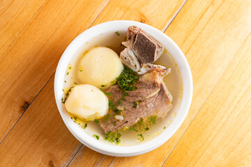 Traditional colombian breakfast - Beef rib broth with potatoes