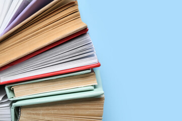 Many colorful books on blue background