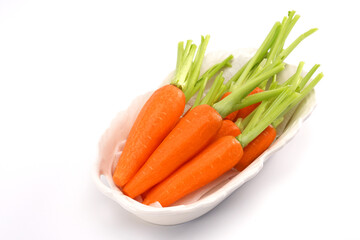Organic mini carrots isolated on white background.