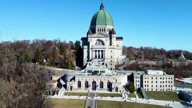 4K drone footage of Montreal, Canada. Aerial view of the downtown skyline, historic buildings, St. Lawrence River, and iconic landmarks during golden hour light.