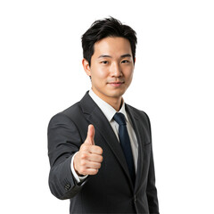 Young Asian businessman in a dark suit and tie giving a thumbs up gesture, looking at the camera with a slight smile. Isolated on a transparent background, studio shot.