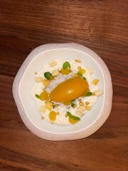 sliced mango on top of tapioca pudding dessert