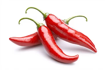 Three vibrant red chili peppers are arranged artfully on a clean white background in close-up.