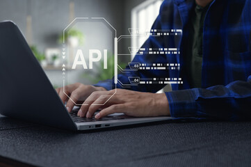 Business Person Working on Laptop with API Interface Visualization