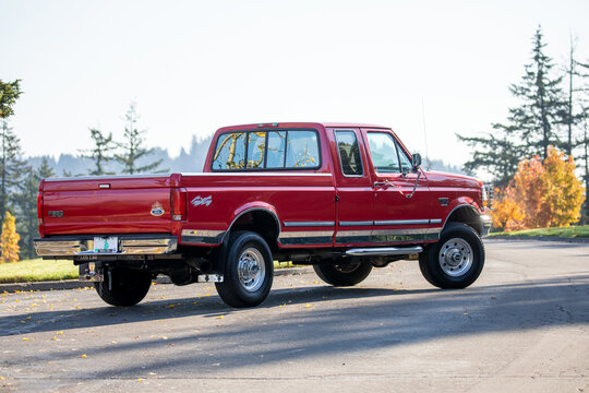 Portland, OR, USA - Nov 21, 2020 - 1997 Dark Red Ford F-250 XLT Heavy Duty Power Stroke Diesel pickup truck American 4X4 SUV off-road vehicle exterior. High quality picture for download	

