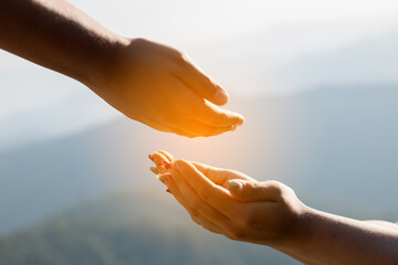 Young woman hand reaching for mountains. Spiritual girl smiling to sky. Happy female being thankful. Spiritual girl praying with hope. Positive asian young woman feeling hope and faith looking up.