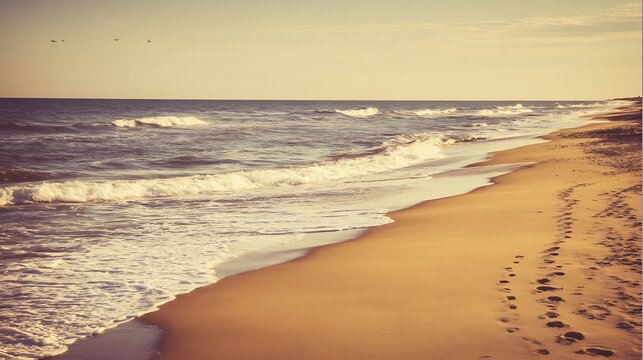 Waves wash the golden sandy beach