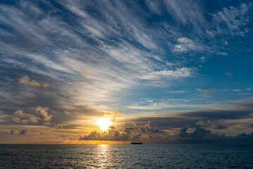 Skyscape with sea sunrise. Peaceful horizon at sea nature. Romantic summer vacation on beach seascape. Sunrise sky horizon. Sea sunset view. Cloudy sunset sky and seascape at summer vacation