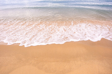 Nature of the beach and sea Summer with sunshine, sandy beaches, clear blue waters sparkling against the blue sky. On an island with good ecology and environment Background for summer vacation