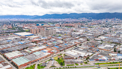 Aerial View of Bogotá's Urban Landscape with Mountains in the Background