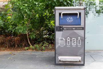 Recycling bin with clear instructions for waste disposal in Orchard Road