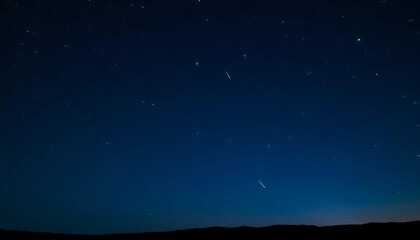 Distant starlight streaks across a deep indigo night sky,  dark,  wonder