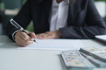 Fototapeta premium Businesswoman Accountant analyzing investment charts Invoice documents. Accounting Bookkeeper Clerk&nbsp;Bank Advisor And Auditor