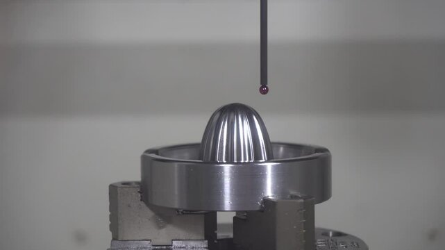 The CMM machine 3D measuring the mold parts by touching probe.