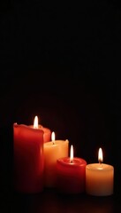 Several burning candles against a deep black, leaving wide open space , wax, meditation, empty space