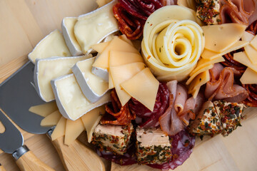 Wooden charcuterie cheese board holiday present idea. Snack starter plate for dinner with wine....
