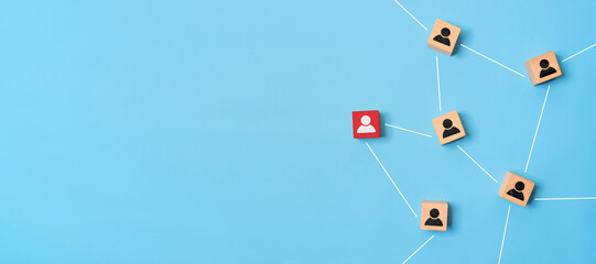 Wooden cubes with person icon on blue background, Organisation structure, social network and community concepts