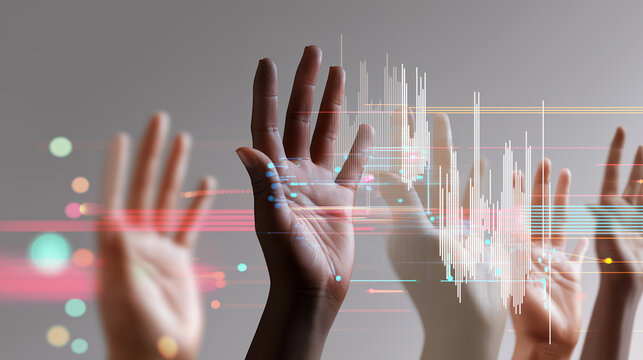 Multiple diverse hands reach upwards towards a glowing digital graph, symbolizing data interaction, business growth, or future trends.
