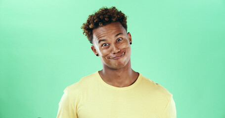 Comic, funny face and smile with black man on green background in studio for humor, joke and meme....