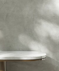 White marble tabletop table with round edge, chrome leg in dappled sunlight on polished cement...