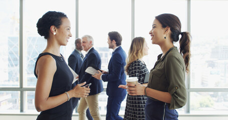Business, conference and women with networking in lobby for global expo, workshop feedback or chat. Professional, people and happy at convention for career development, startup ideas or collaboration