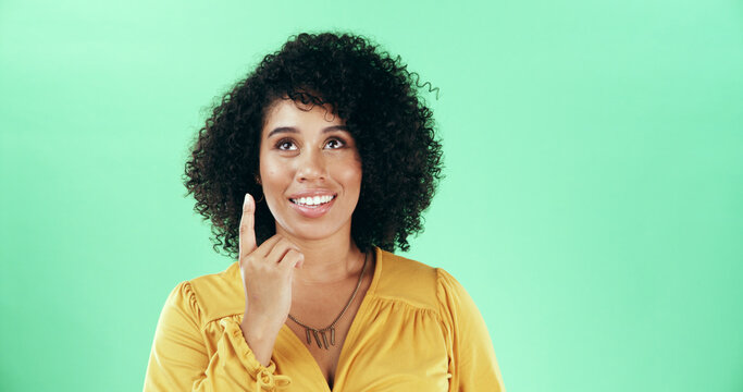 Thinking, pointing and woman in studio with choice, decision or ideas for education career. Happy, mockup space and female teacher with planning for lesson with problem solving by green background. - Powered by Adobe