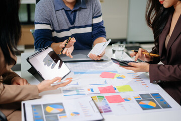 Business documents on office table with smart phone and calculator digital tablet and graph business with social network diagram