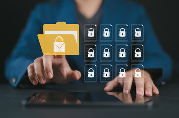 Secure data management concept with businessman using tablet. Locked digital folder and documents represent cybersecurity, safe information storage and file protection, privacy policy
