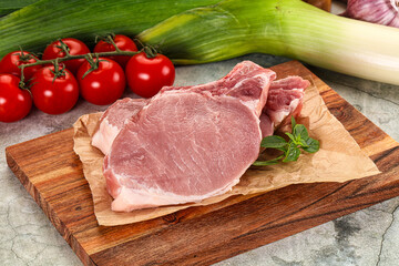 Raw pork steak loin with bone