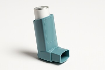 Blue asthma inhaler isolated on white background for respiratory care