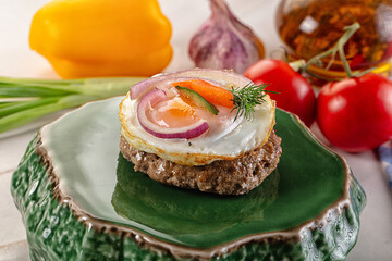 Beefsteak chop with roasted egg