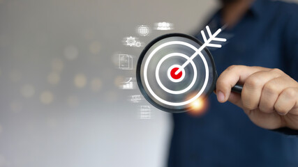 Business focus and leadership vision: magnifier zooming into target area, representing analysis of...