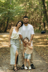 Loving Family Enjoying Time Together Outdoors in a Serene Forest Setting