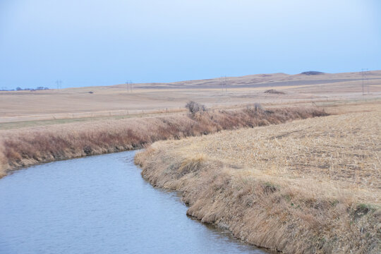 small creek cutting through the farm land