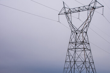 Powerlines against a grey sky