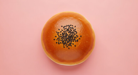 Anpan A glazed Japanese sweet roll filled with red bean paste and sesame seeds