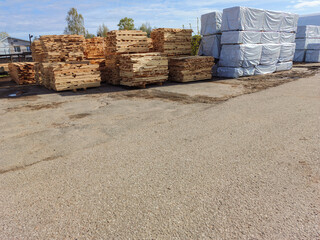 Lumber, boards, stacked. Products packed in polyethylene.