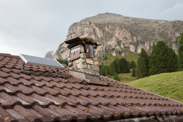 Small photovoltaic panel on the roof of a refuge in the Dolomites area