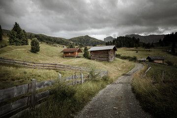 small house over a mountain pasture in Dolomites with wonderful panorama