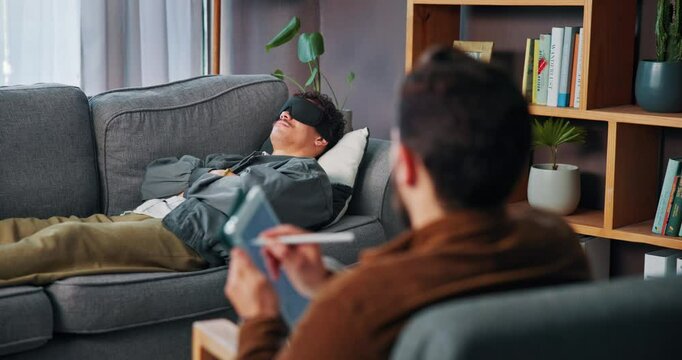 Man, relax and consultation with psychologist for therapy or hypnotherapy with tablet in office. Counselor, notes and help patient on sofa with eye mask for insomnia, sleep paralysis or mental health
