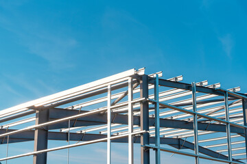 Naklejka premium Construction process of new industrial building warehouse structure made of steel frame