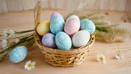 multicolor decorated easter egg in a basket on wooden table.ai 