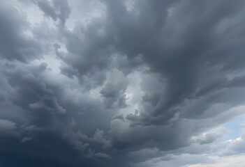 Fototapeta premium Ominous Grey Clouds Formed into a Dramatic Sky with Heavy Weather Potential