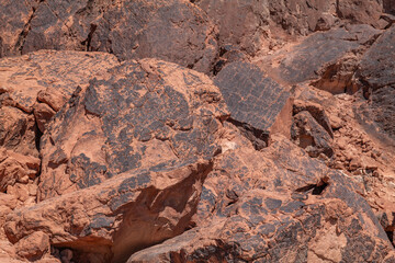  red Aztec Sandstone outcrops, Early Jurassic geological formation of primarily eolian sand. Fire Wave Trail, Valley of Fire State Park, Clark County, Nevada geology. 
