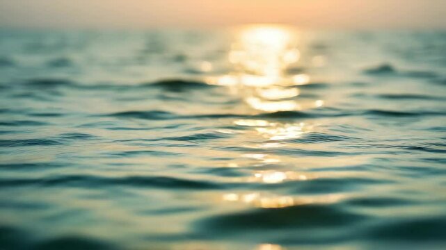 Teal Blue Ocean Water with Golden Light Reflection Creating a Boken Effect at Sunset