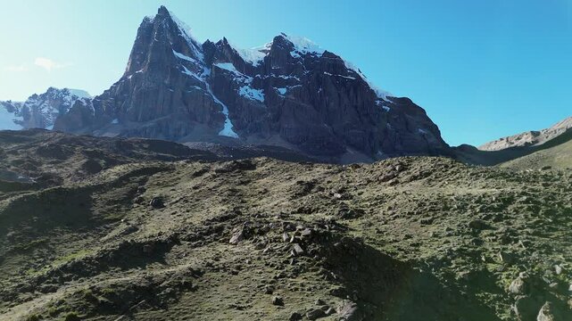 Flyover rugged talus terrain of Elefante Pampa toward Peru mtn peak