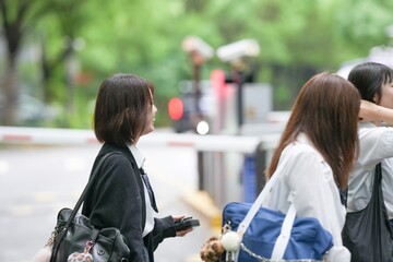 In early June in Pudong, Shanghai, seven Japanese high school girls in summer uniforms walk...